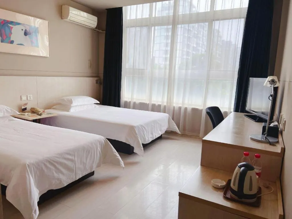 Bed in Jinjiang Inn Tai Zhou Xinghua Yingwu Bridge Branch