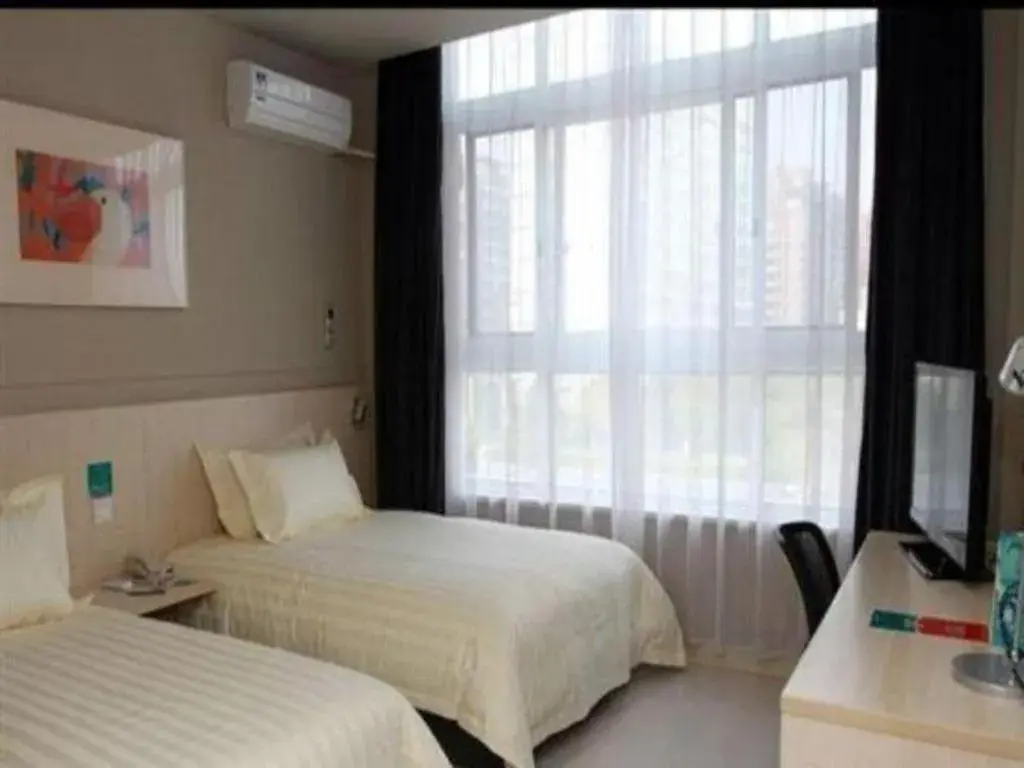 Bed in Jinjiang Inn Tai Zhou Xinghua Yingwu Bridge Branch Bed in Jinjiang Inn Tai Zhou Xinghua Yingwu Bridge Branch