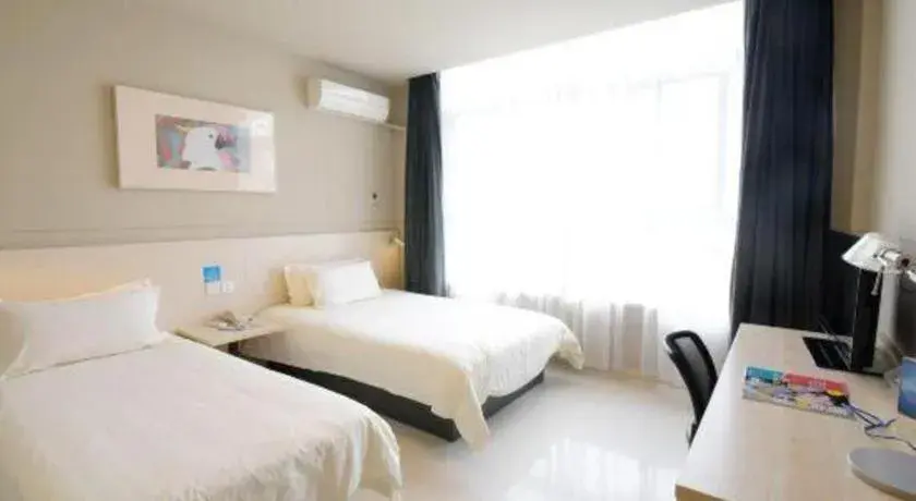 Bed in Jinjiang Inn Tai Zhou Xinghua Yingwu Bridge Branch Bed in Jinjiang Inn Tai Zhou Xinghua Yingwu Bridge Branch