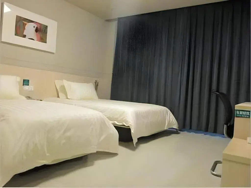 Bed in Jinjiang Inn Tai Zhou Xinghua Yingwu Bridge Branch Bed in Jinjiang Inn Tai Zhou Xinghua Yingwu Bridge Branch