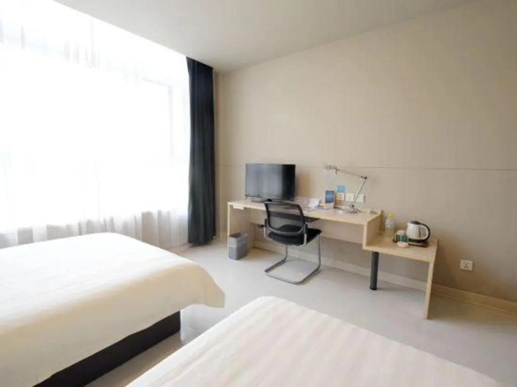 Bed in Jinjiang Inn Tai Zhou Xinghua Yingwu Bridge Branch