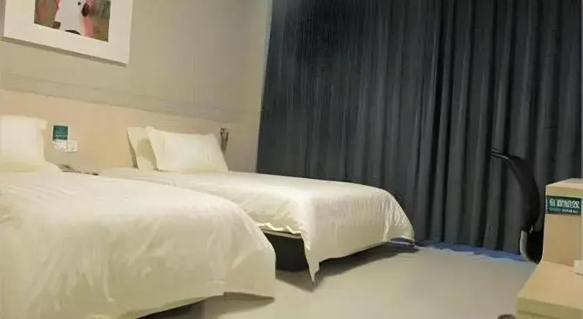 Bed in Jinjiang Inn Tai Zhou Xinghua Yingwu Bridge Branch Bed in Jinjiang Inn Tai Zhou Xinghua Yingwu Bridge Branch