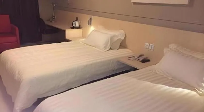 Bed in Jinjiang Inn Tai Zhou Xinghua Yingwu Bridge Branch