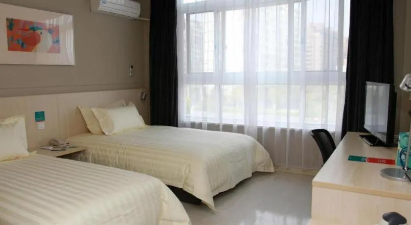 Bed in Jinjiang Inn Tai Zhou Xinghua Yingwu Bridge Branch