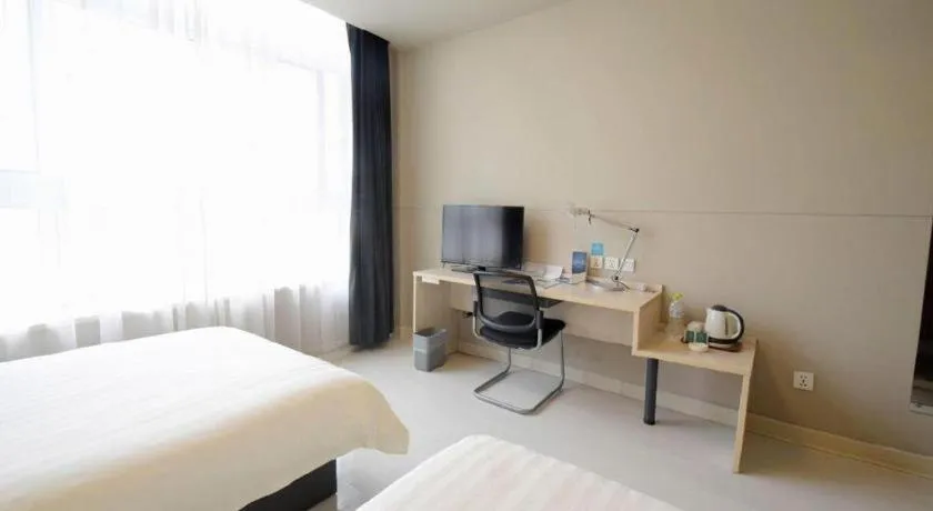 Bed in Jinjiang Inn Tai Zhou Xinghua Yingwu Bridge Branch