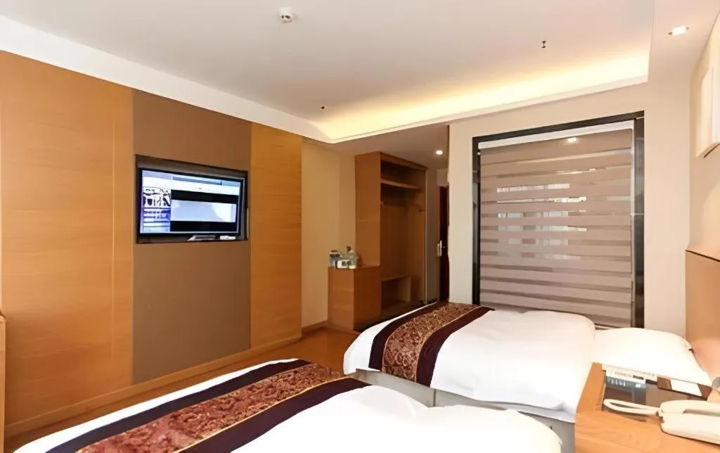 Bed in GreenTree Inn Jiangsu Wuxi Huishan High-Speed Rail Qianzhou Chongwen Road Business Hotel