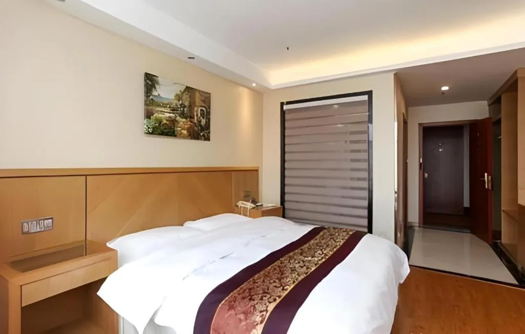 Bed in GreenTree Inn Jiangsu Wuxi Huishan High-Speed Rail Qianzhou Chongwen Road Business Hotel