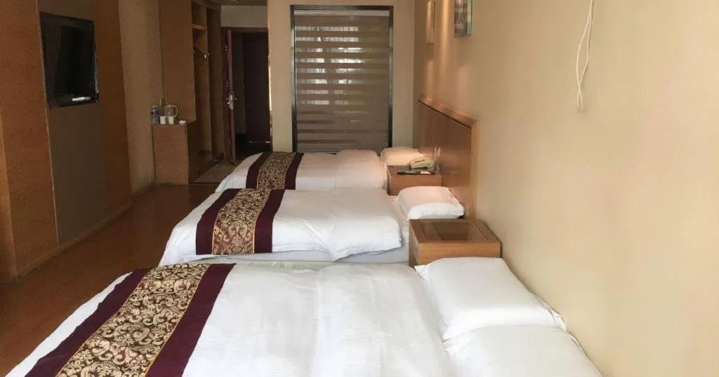 Bed in GreenTree Inn Jiangsu Wuxi Huishan High-Speed Rail Qianzhou Chongwen Road Business Hotel