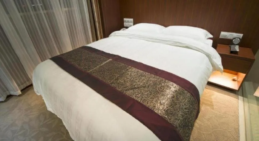 Bed in Sunparkview Hotel Shanghai