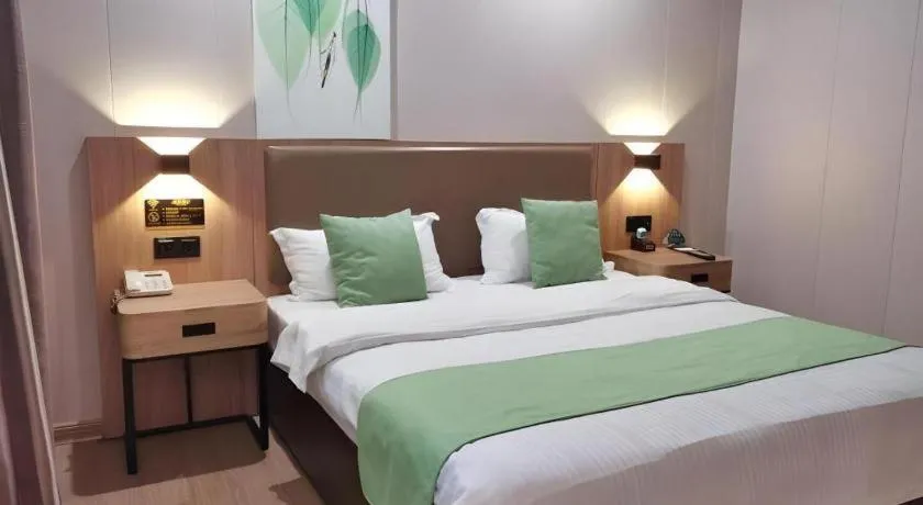 Bed in GreenTree Inn Jining Yanzhou Jiuzhou Fangyuan Business Hotel