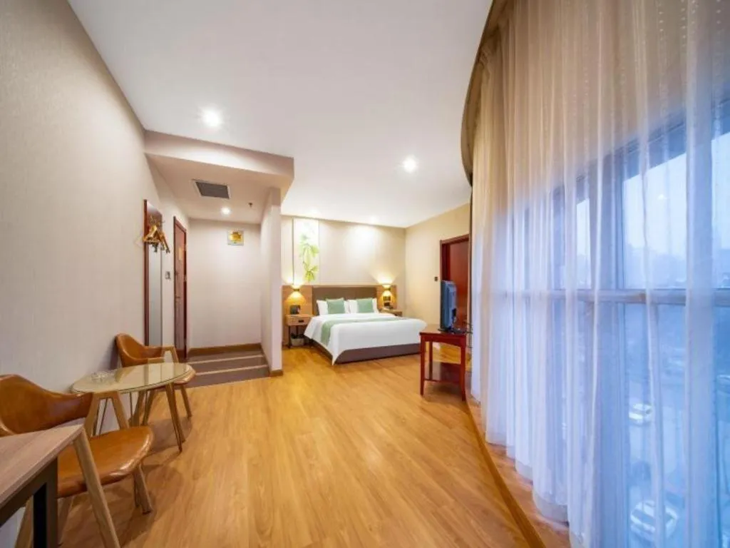 Bed in GreenTree Inn Jining Yanzhou Jiuzhou Fangyuan Business Hotel