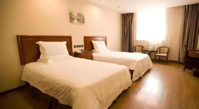 Bed in GreenTree Inn Jining Yanzhou Jiuzhou Fangyuan Business Hotel