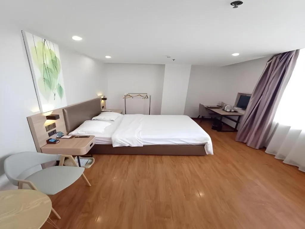 Bed in GreenTree Inn Jining Yanzhou Jiuzhou Fangyuan Business Hotel