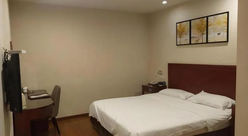 Bed in GreenTree Inn Jining Yanzhou Jiuzhou Fangyuan Business Hotel