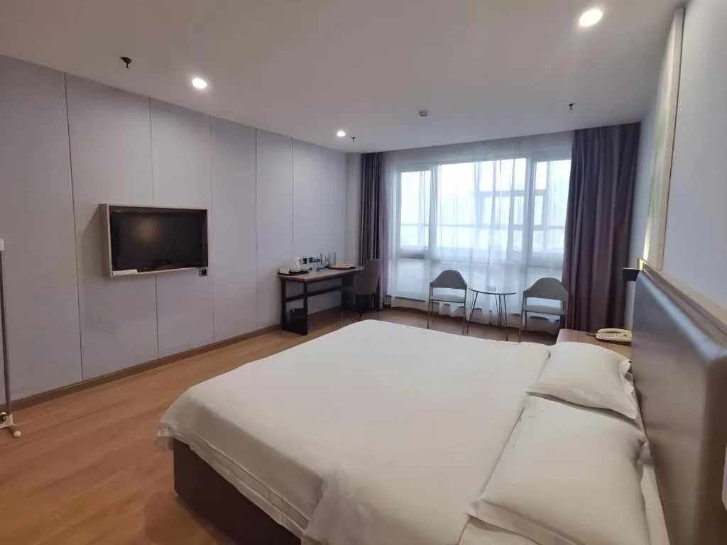 Bed in GreenTree Inn Jining Yanzhou Jiuzhou Fangyuan Business Hotel