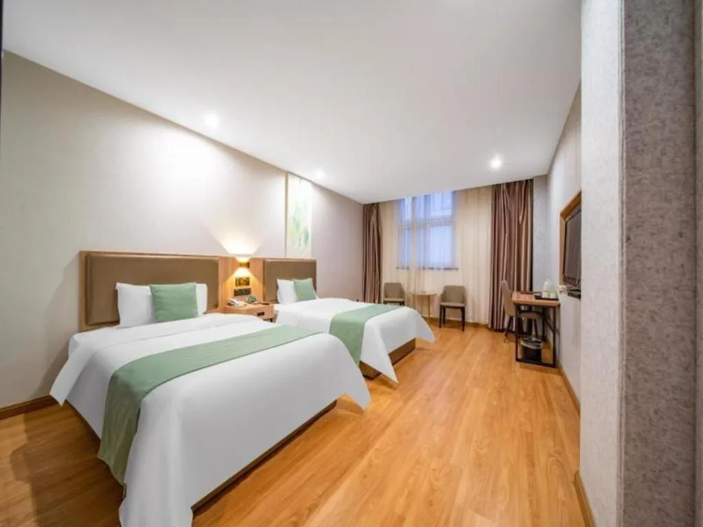 Bed in GreenTree Inn Jining Yanzhou Jiuzhou Fangyuan Business Hotel