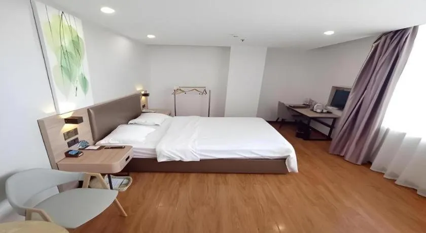 Bed in GreenTree Inn Jining Yanzhou Jiuzhou Fangyuan Business Hotel
