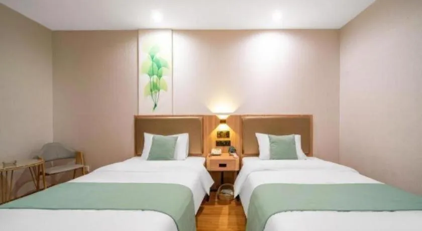 Bed in GreenTree Inn Jining Yanzhou Jiuzhou Fangyuan Business Hotel
