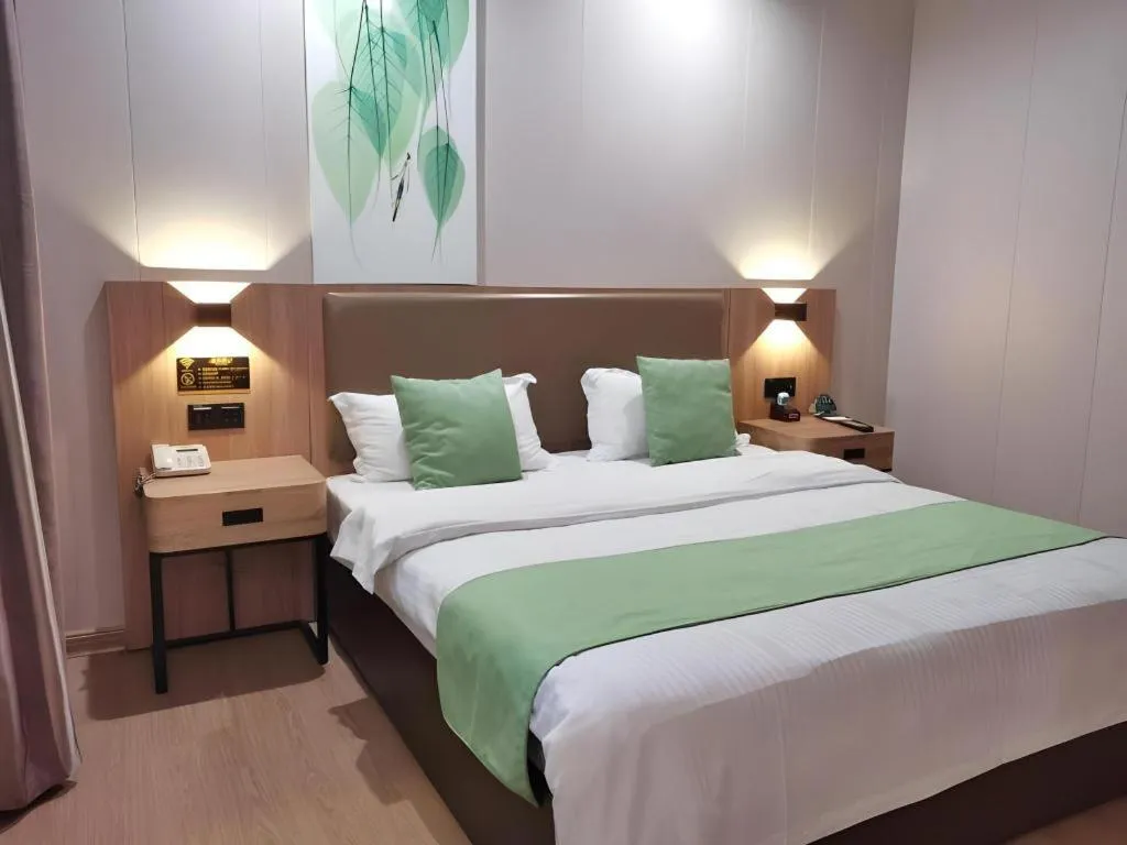 Bed in GreenTree Inn Jining Yanzhou Jiuzhou Fangyuan Business Hotel