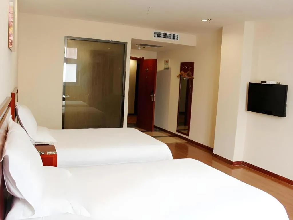 Bed in GreenTree Inn Jining Yanzhou Jiuzhou Fangyuan Business Hotel