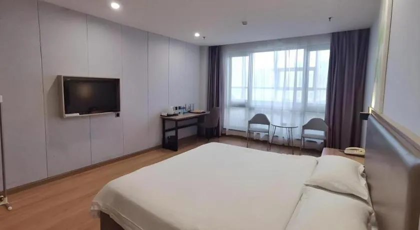 Bed in GreenTree Inn Jining Yanzhou Jiuzhou Fangyuan Business Hotel