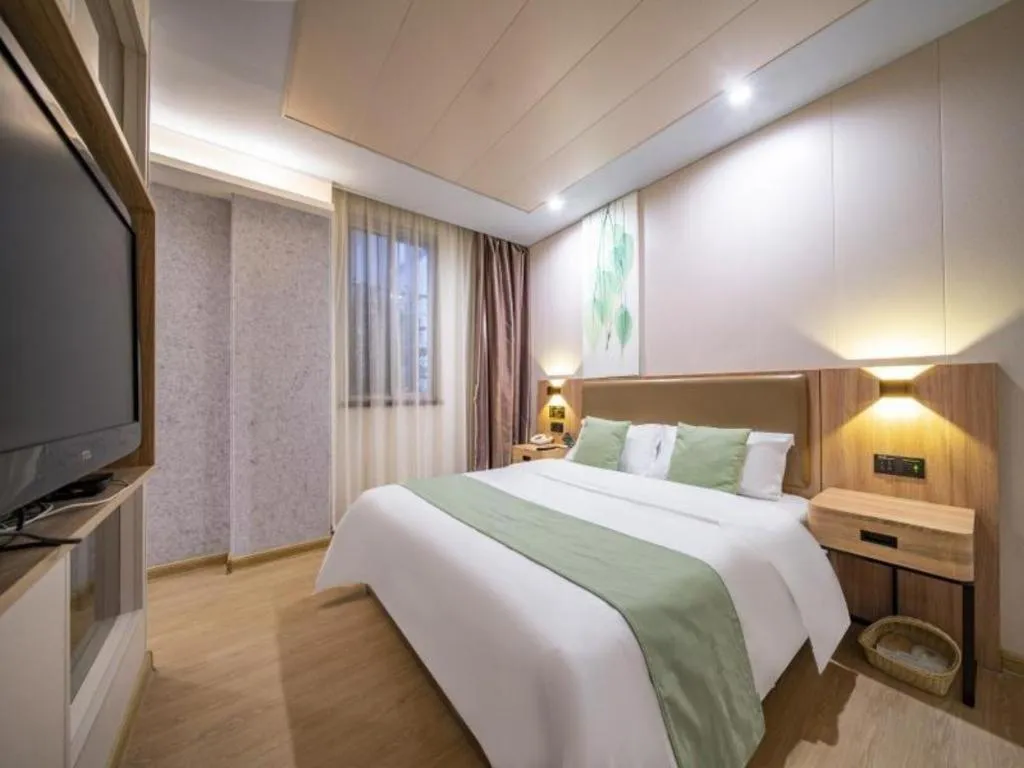 Bed in GreenTree Inn Jining Yanzhou Jiuzhou Fangyuan Business Hotel