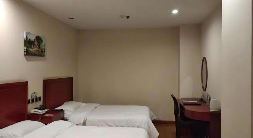 Bed in GreenTree Inn Jining Yanzhou Jiuzhou Fangyuan Business Hotel