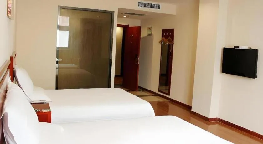 Bed in GreenTree Inn Jining Yanzhou Jiuzhou Fangyuan Business Hotel