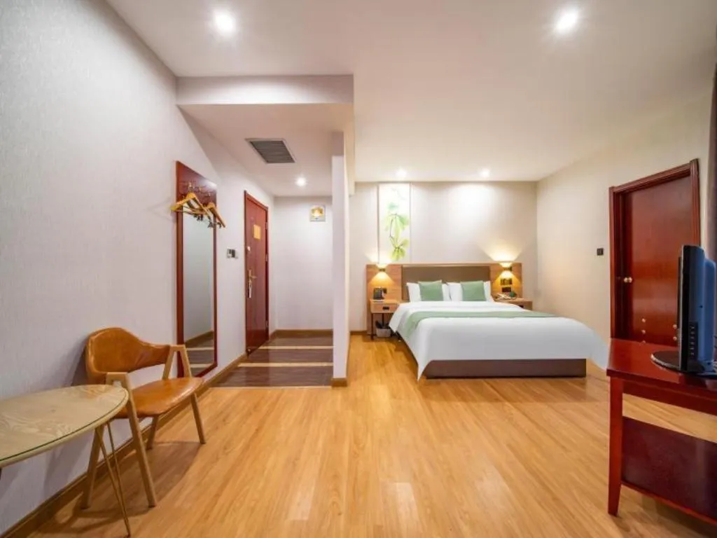Bed in GreenTree Inn Jining Yanzhou Jiuzhou Fangyuan Business Hotel