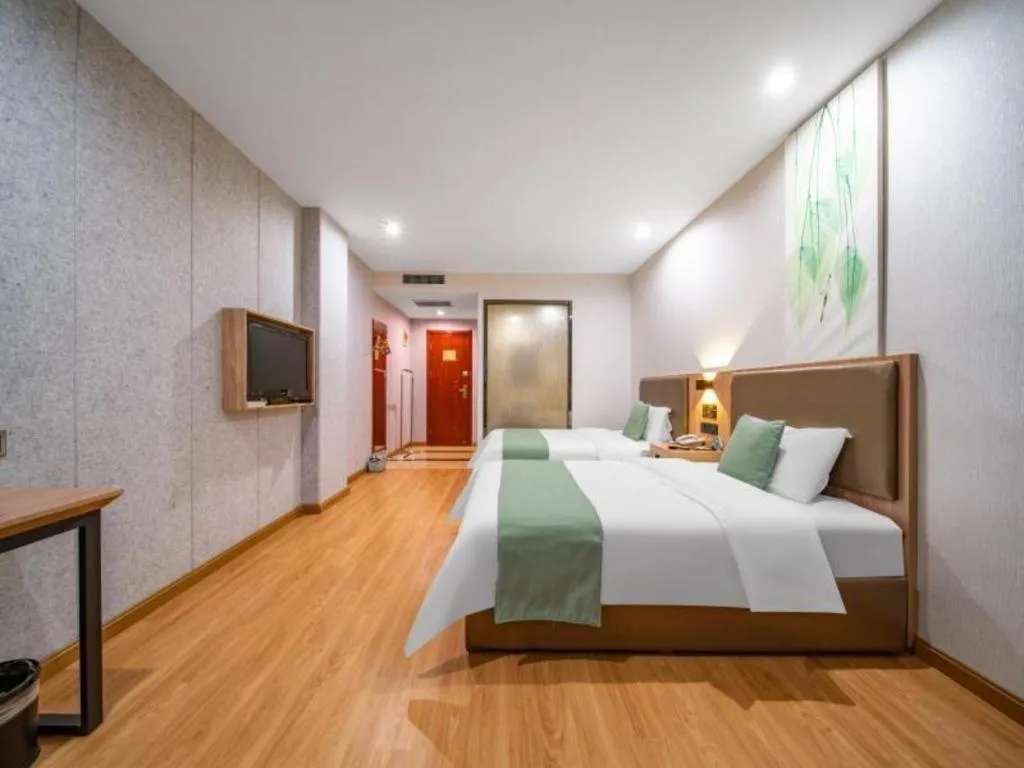 Bed in GreenTree Inn Jining Yanzhou Jiuzhou Fangyuan Business Hotel