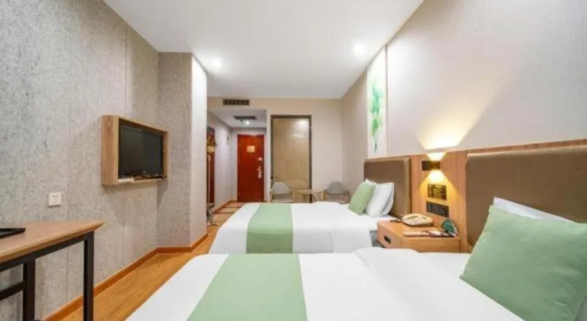 Bed in GreenTree Inn Jining Yanzhou Jiuzhou Fangyuan Business Hotel