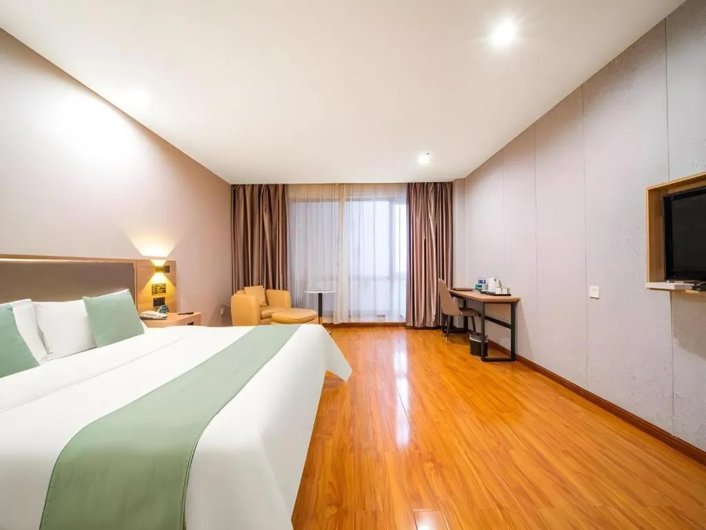 Bed in GreenTree Inn Jining Yanzhou Jiuzhou Fangyuan Business Hotel