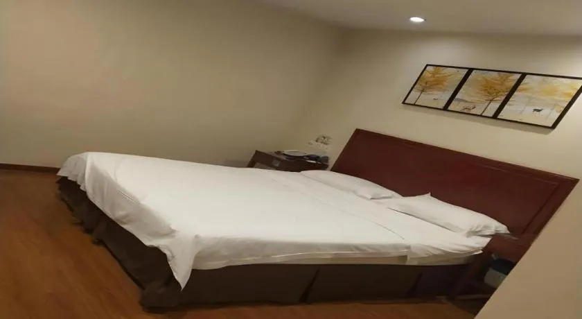 Bed in GreenTree Inn Jining Yanzhou Jiuzhou Fangyuan Business Hotel
