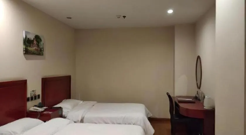 Bed in GreenTree Inn Jining Yanzhou Jiuzhou Fangyuan Business Hotel