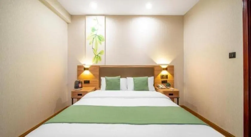 Bed in GreenTree Inn Jining Yanzhou Jiuzhou Fangyuan Business Hotel