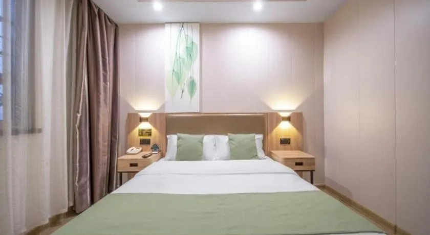 Bed in GreenTree Inn Jining Yanzhou Jiuzhou Fangyuan Business Hotel