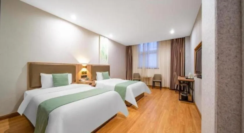 Bed in GreenTree Inn Jining Yanzhou Jiuzhou Fangyuan Business Hotel