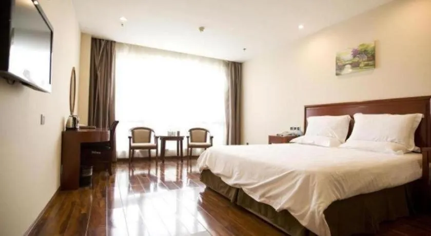 Bed in GreenTree Inn Jining Yanzhou Jiuzhou Fangyuan Business Hotel