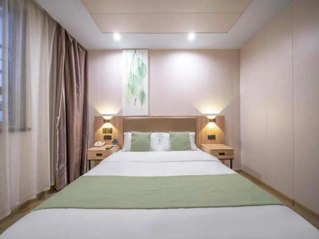Bed in GreenTree Inn Jining Yanzhou Jiuzhou Fangyuan Business Hotel