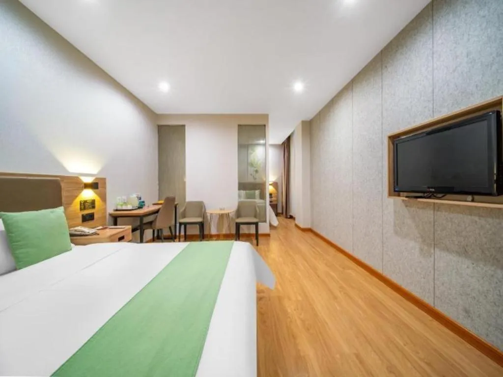 Bed in GreenTree Inn Jining Yanzhou Jiuzhou Fangyuan Business Hotel