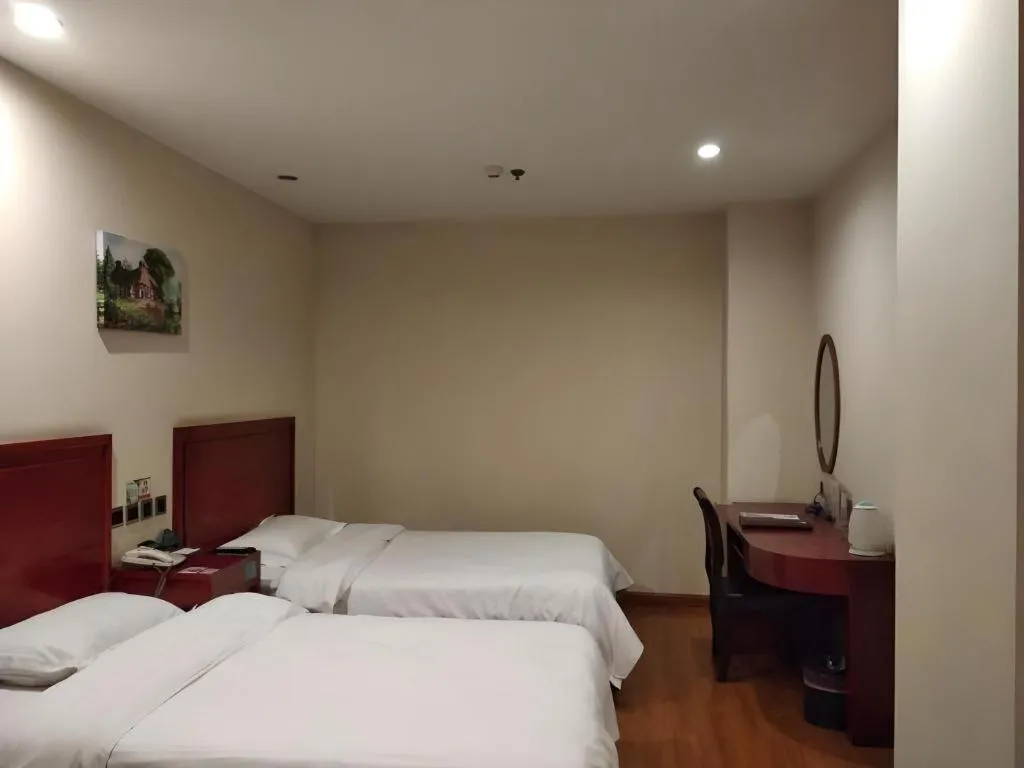Bed in GreenTree Inn Jining Yanzhou Jiuzhou Fangyuan Business Hotel