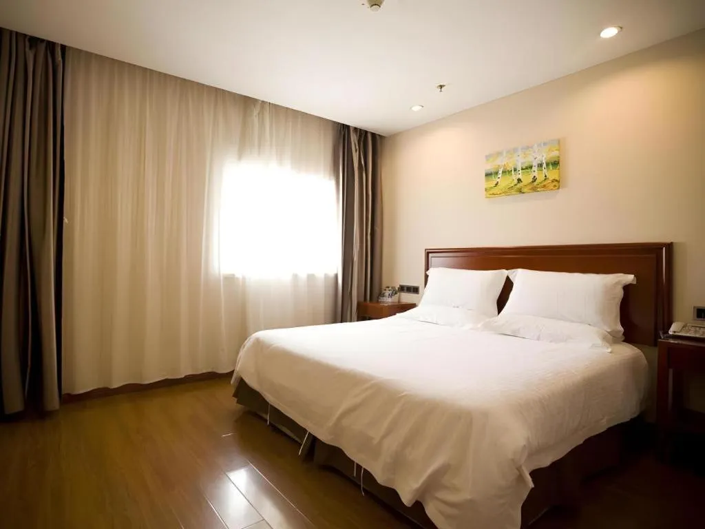 Bed in GreenTree Inn Jining Yanzhou Jiuzhou Fangyuan Business Hotel