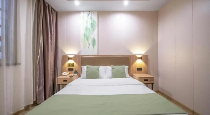 Bed in GreenTree Inn Jining Yanzhou Jiuzhou Fangyuan Business Hotel