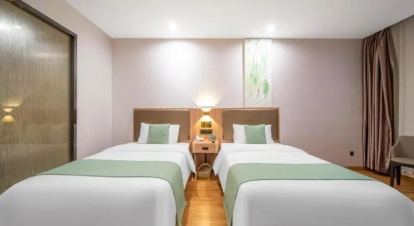 Bed in GreenTree Inn Jining Yanzhou Jiuzhou Fangyuan Business Hotel