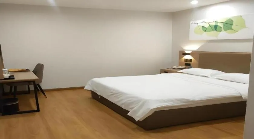 Bed in GreenTree Inn Jining Yanzhou Jiuzhou Fangyuan Business Hotel