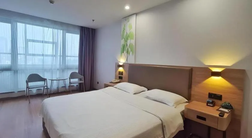 Bed in GreenTree Inn Jining Yanzhou Jiuzhou Fangyuan Business Hotel