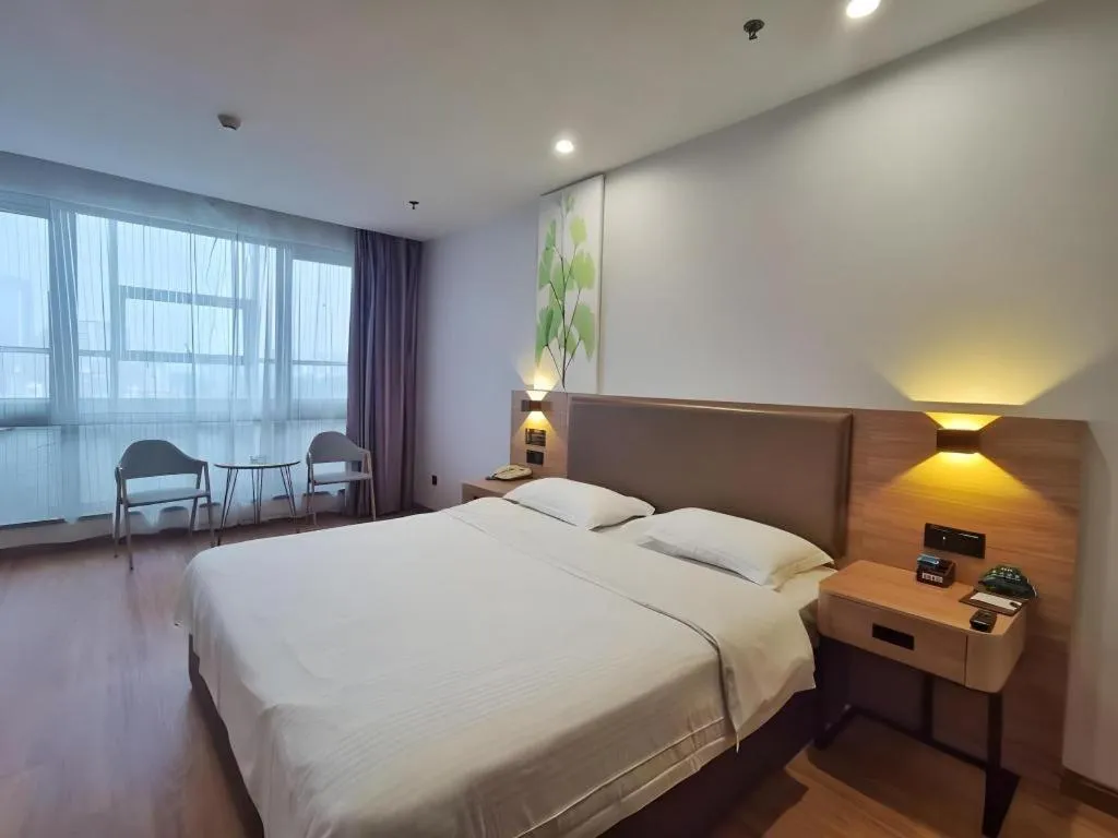 Bed in GreenTree Inn Jining Yanzhou Jiuzhou Fangyuan Business Hotel