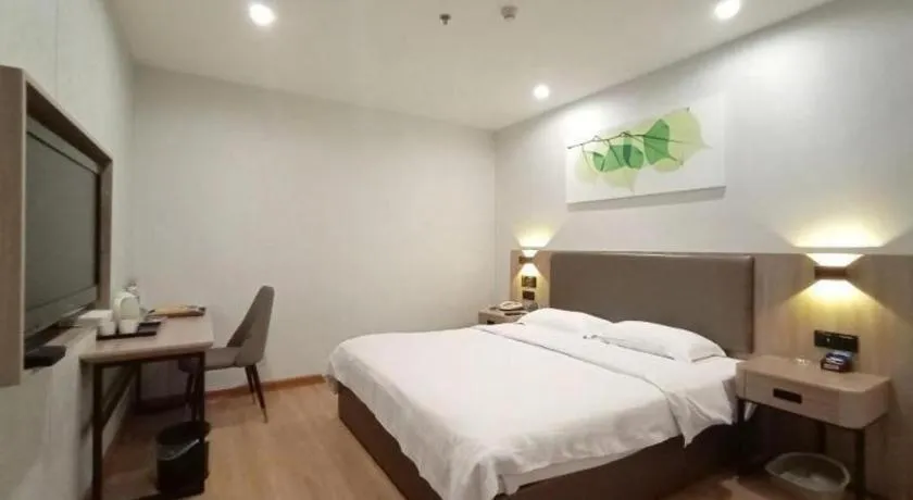 Bed in GreenTree Inn Jining Yanzhou Jiuzhou Fangyuan Business Hotel