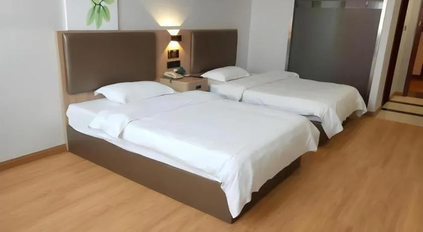 Bed in GreenTree Inn Jining Yanzhou Jiuzhou Fangyuan Business Hotel
