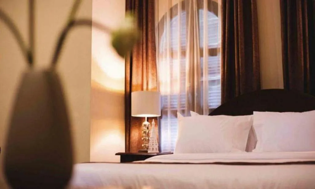 Bed in Le Luxe Boutique Hotel